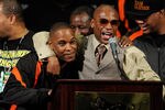 LAS VEGAS, NV - SEPTEMBER 17:  Boxer Floyd Mayweather Jr. (R) hugs his cousin and camp coordinator DeJuan Blake during a post-fight news conference after Mayweather defeated Victor Ortiz to win the WBC welterweight title at the MGM Grand Garden Arena September 17, 2011 in Las Vegas, Nevada.  (Photo by Ethan Miller/Getty Images)