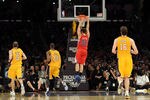 LOS ANGELES, CA - DECEMBER 19:  Blake Griffin #32 of the Los Angeles Clippers is called for a technical foul after hanging on the rim off a dunk in front of Steve Blake #5 Kobe Bryant #24 and Pau Gasol #16 of the Los Angeles Lakers at Staples Center on December 19, 2011 in Los Angeles, California.  (Photo by Harry How/Getty Images)