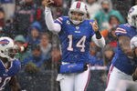 ORCHARD PARK, NY - DECEMBER 18: Ryan Fitzpatrick #14 of the Buffalo Bills fakes a pass before getting sacked during their NFL game against the Miami Dolphins at Ralph Wilson Stadium on December 18, 2011 in Orchard Park, New York. (Photo by Tom Szczerbowski/Getty Images)