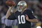 SOUTH BEND, IN - OCTOBER 29:  Dayne Crist #10 of the Notre Dame Fighting Irish looks for a receiver against the Navy Midshipmen at Notre Dame Stadium on October 29, 2011 in South Bend, Indiana. Notre Dame defeated Navy 56-14.  (Photo by Jonathan Daniel/Getty Images)
