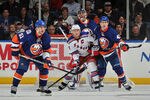 UNIONDALE, NY - NOVEMBER 15: Ryan Callahan #24 of the New York Rangers and Andrew MacDonald #47 of the New York Islanders obstruct the view of Evgeni Nabokov #20 of the New York Islanders during a power play in the second period at Nassau Coliseum on November 15, 2011 in Uniondale, New York. (Photo by Christopher Pasatieri/Getty Images)