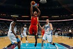 NEW ORLEANS, LA - JANUARY 02:  Chuck Hayes #44  of the Houston Rockets makes a shot over Darius Songaila #9 and Emeka Okafor #50 of the New Orleans Hornets at the New Orleans Arena on January 2, 2010 in New Orleans, Louisiana.  NOTE TO USER: User expressly acknowledges and agrees that, by downloading and/or using this Photograph, User is consenting to the terms and conditions of the Getty Images License Agreement.  (Photo by Chris Graythen/Getty Images)