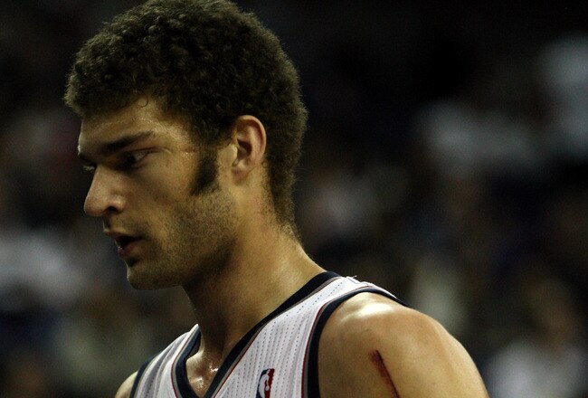 LONDON, ENGLAND - MARCH 04:  Nets Captain, Brook Lopez #11 leaves the court during the NBA match between New Jersey Nets and the Toronto Raptors at the O2 Arena on March 4, 2011 in London, England. NOTE TO USER: User expressly acknowledges and agrees that, by downloading and/or using this Photograph, User is consenting to the terms and conditions of the Getty Images License Agreement.  (Photo by Warren Little/Getty Images)