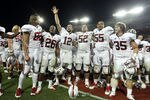 TUCSON, AZ - SEPTEMBER 17:  Quarterback Andrew Luck #12 (C) of the Stanford Cardinal celebrates with teammates after defeating the Arizona Wildcats in the college football game at Arizona Stadium on September 17, 2011 in Tucson, Arizona. The Cardinal defeated the Wildcats 37-10. (Photo by Christian Petersen/Getty Images)