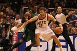 EAST RUTHERFORD, NJ - JANUARY 13:  Brook Lopez #11 of the New Jersey Nets dribbles against Glen Davis #11 of The Boston Celtics during their game on January 13th, 2010 at The Izod Center in East Rutherford, New Jersey. NOTE TO USER: User expressly acknowledges and agrees that, by downloading and/or using this Photograph, User is consenting to the terms and conditions of the Getty Images License Agreement.  Photo By Al Bello/Getty Images  (Photo by Al Bello/Getty Images)