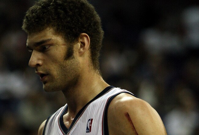 LONDON, ENGLAND - MARCH 04:  Nets Captain, Brook Lopez #11 leaves the court during the NBA match between New Jersey Nets and the Toronto Raptors at the O2 Arena on March 4, 2011 in London, England. NOTE TO USER: User expressly acknowledges and agrees that, by downloading and/or using this Photograph, User is consenting to the terms and conditions of the Getty Images License Agreement.  (Photo by Warren Little/Getty Images)