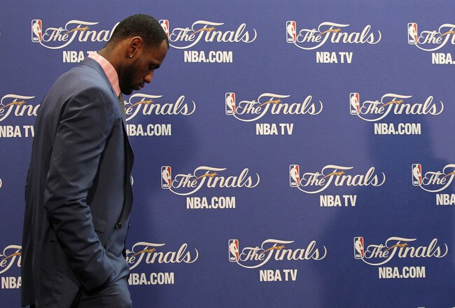 MIAMI, FL - JUNE 12:  LeBron James #6 of the Miami Heat walks into the interview room to answer questions after the Heat were defeated 105-95 by the Dallas Mavericks in Game Six of the 2011 NBA Finals at American Airlines Arena on June 12, 2011 in Miami, Florida. NOTE TO USER: User expressly acknowledges and agrees that, by downloading and/or using this Photograph, user is consenting to the terms and conditions of the Getty Images License Agreement.  (Photo by Mike Ehrmann/Getty Images)