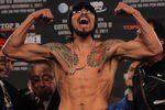 NEW YORK, NY - DECEMBER 02:  Antonio Margarito of Mexico flexes as he takes the scale for his bout with Miguel Cotto of Puerto Rico during their weigh in at The Theater at Madison Square Garden on December 2, 2011 in New York City.  (Photo by Nick Laham/Getty Images)