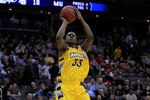 NEWARK, NJ - MARCH 25:  Jimmy Butler #33 of the Marquette Golden Eagles in action against the North Carolina Tar Heels during the east regional semifinal of the 2011 NCAA Men's Basketball Tournament at the Prudential Center on March 25, 2011 in Newark, New Jersey.  (Photo by Chris Trotman/Getty Images)