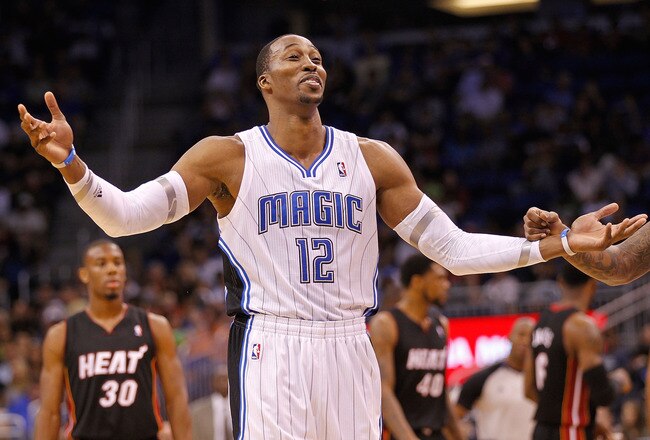 ORLANDO, FL - DECEMBER 21: Dwight Howard #12 of the Orlando Magic argues a call during a preseason game against the Miami Heat at Amway Center on December 21, 2011 in Orlando, Florida. NOTE TO USER: User expressly acknowledges and agrees that, by downloading and/or using this Photograph, User is consenting to the terms and conditions of the Getty Images License Agreement.  (Photo by Mike Ehrmann/Getty Images)