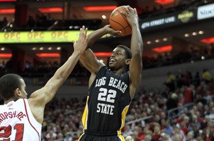 LOUISVILLE, KY - NOVEMBER 28:  Casper Ware #22 of the Long Beach State 49ers shoots the ball during the game while defended by Jared Swopshire #21 of the Louisville Cardinals during the game at KFC YUM! Center on November 28, 2011 in Louisville, Kentucky.  (Photo by Andy Lyons/Getty Images)