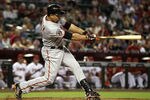 PHOENIX, AZ - SEPTEMBER 23:  Carlos Beltran #15 of the San Francisco Giants hits a single agianst the Arizona Diamondbacks during the first inning of the Major League Baseball game at Chase Field on September 23, 2011 in Phoenix, Arizona.  (Photo by Christian Petersen/Getty Images)
