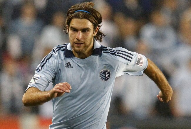 KANSAS CITY, KS - NOVEMBER 06:  Graham Zusi #8 of the Sporting Kansas City passes the ball against the Houston Dynamo in the second half during the MLS Eastern Conference Championship match at Livestrong Sporting Park on November 6, 2011 in Kansas City, Kansas.  (Photo by Kyle Rivas/Getty Images)