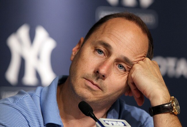 NEW YORK, NY - JULY 08:  General manager Brian Cashman of the New York Yankees speaks to the media after the game against the Tampa Bay Rays was postponed due to rain on July 8, 2011 at Yankee Stadium in the Bronx borough of New York City.  (Photo by Jim McIsaac/Getty Images)