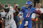 FORT COLLINS, CO - OCTOBER 15:  Quarterback Kellen Moore #11 of the Boise State Broncos delivers a pass as Nordly Capi #11 of the Colorado State Rams pressures him at Sonny Lubick Field at Hughes Stadium on October 15, 2011 in Fort Collins, Colorado.  (Photo by Doug Pensinger/Getty Images)