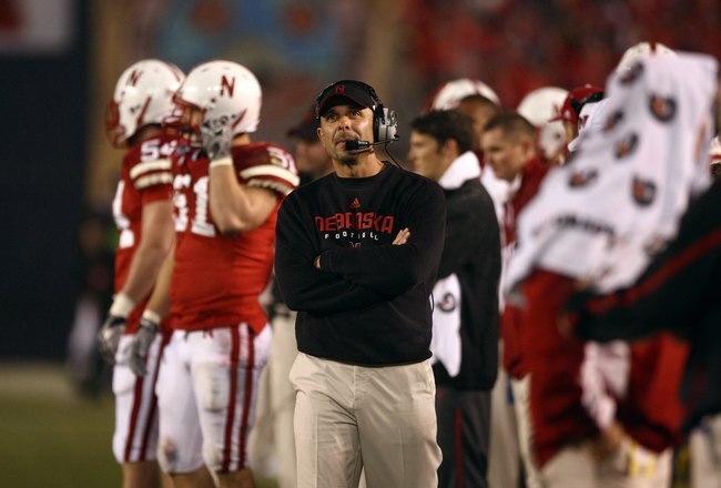 SAN DIEGO - DECEMBER 30:  Defensive Coordinator Carl Pelini of the University of Nebraska Cornhuskers looks on from the sideline during the Pacific Life Holiday Bowl against University of Arizona Wildcats on December 30, 2009 at Qualcomm Stadium in San Diego, California. The Cornhuskers defeated the Wildcats 33-0. (Photo By Donald Miralle/Getty Images)