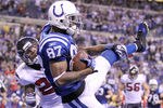 INDIANAPOLIS, IN - DECEMBER 22:  Reggie Wayne #87 of the Indianapolis Colts catches the game winning touchdown during the NFL against the Houston Texans at Lucas Oil Stadium on December 22, 2011 in Indianapolis, Indiana.  The Colts won 19-16.  (Photo by Andy Lyons/Getty Images)