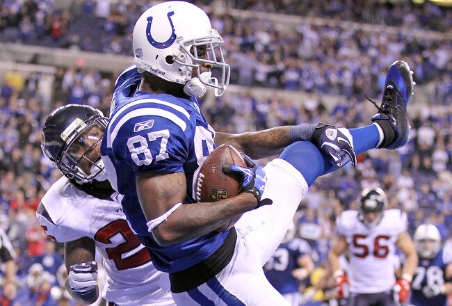 INDIANAPOLIS, IN - DECEMBER 22:  Reggie Wayne #87 of the Indianapolis Colts catches the game winning touchdown during the NFL against the Houston Texans at Lucas Oil Stadium on December 22, 2011 in Indianapolis, Indiana.  The Colts won 19-16.  (Photo by Andy Lyons/Getty Images)