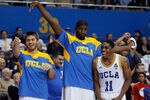 LOS ANGELES, CA - DECEMBER 20:  (L-R) Matt DeMarcus #13, Anthony Stover #0 and Lazeric Jones #11 of the UCLA Bruins celebrate on the bench against the UC Irvine Anteaters in the second half at LA Sports Arena on December 20, 2011 in Los Angeles, California. UCLA defeated UC-Irvine 89-60.  (Photo by Jeff Gross/Getty Images)