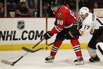 CHICAGO, IL - DECEMBER 16: Patrick Kane #88 of the Chicago Blackhawks controls the puck under pressure from Lubomir Visnovsky #17 of the Anaheim Ducks at the United Center on December 16, 2011 in Chicago, Illinois. The Blackhawks defeated the Ducks 4-1. (Photo by Jonathan Daniel/Getty Images)