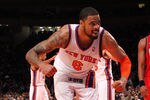 NEW YORK, NY - DECEMBER 21:  Tyson Chandler #6 of the New York Knicks celebrates a basket against the New Jersey Nets during their pre season game  at Madison Square Garden on December 21, 2011 in New York City. NOTE TO USER: User expressly acknowledges and agrees that, by downloading and or using this photograph, User is consenting to the terms and conditions of the Getty Images License Agreement.   (Photo by Al Bello/Getty Images)