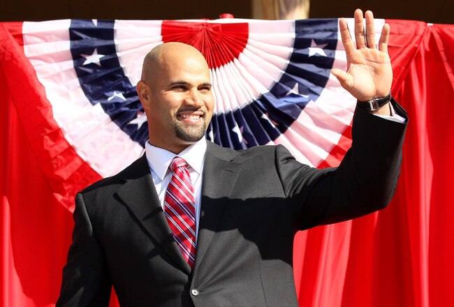 ANAHEIM, CA - DECEMBER 10:  Albert Pujols waves as he takes the stage at a public press conference introducing newly signed Los Angeles Angels of Anaheim  players Albert Pujols and C.J. Wilson at Angel Stadium on December 10, 2011 in Anaheim, California.  (Photo by Stephen Dunn/Getty Images)