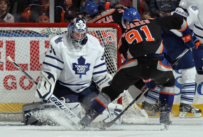 UNIONDALE, NY - DECEMBER 23:  John Tavares #91 of the New York Islanders scores at 10:30 of the third period against James Reimer #34 of the Toronto Maple Leafs at the Nassau Veterans Memorial Coliseum on December 23, 2011 in Uniondale, New York. The Maple Leafs defeated the Islanders 5-3. (Photo by Bruce Bennett/Getty Images)