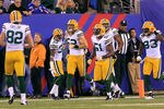 EAST RUTHERFORD, NJ - DECEMBER 04:  Clay Matthews #52 of the Green Bay Packers celebrates with teammates after he returned an interception 38-yards for a touchdown in the second quarter against the New York Giants at MetLife Stadium on December 4, 2011 in East Rutherford, New Jersey.  (Photo by Chris Trotman/Getty Images)