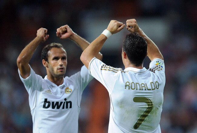 MADRID, SPAIN - SEPTEMBER 10:  Cristiano Ronaldo of Real Madrid celebrates with Ricardo Carvalho after scoring their second goal during the La Liga match bewteen Real Madrid and Getafe at Estadio Santiago Bernabeu on September 10, 2011 in Madrid, Spain.  (Photo by Denis Doyle/Getty Images)