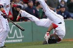 BOSTON, MA - SEPTEMBER 17:  Carl Crawford #13 of the Boston Red Sox tumbles after scoring a run at home as teammate Marco Scutaro #10 of the Boston Red Sox watches during a game with the Tampa Bay Rays in the third inning at Fenway Park September 17, 2011 in Boston, Massachusetts. (Photo by Jim Rogash/Getty Images)