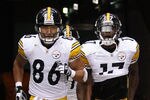 GLENDALE, AZ - OCTOBER 23:  Wide receivers Hines Ward #86 and Mike Wallace #17 of the Pittsburgh Steelers run out onto the field before the NFL game against the Arizona Cardinals at the University of Phoenix Stadium on October 23, 2011 in Glendale, Arizona. The Steelers defeated the Cardinals 32-20.  (Photo by Christian Petersen/Getty Images)
