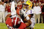 TUSCALOOSA, AL - NOVEMBER 05:  Eric Reid #1 of the LSU Tigers makes a catch over Michael Williams #89 of the Alabama Crimson Tide for an interception during the second half of the game at Bryant-Denny Stadium on November 5, 2011 in Tuscaloosa, Alabama.  (Photo by Kevin C. Cox/Getty Images)