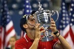 NEW YORK, NY - SEPTEMBER 12:  Novak Djokovic of Serbia kisses the trophy as he celebrates defeating Rafael Nadal of Spain during the Men's Final on Day Fifteen of the 2011 US Open at the USTA Billie Jean King National Tennis Center on September 12, 2011 in the Flushing neighborhood of the Queens borough of New York City.  (Photo by Clive Brunskill/Getty Images)