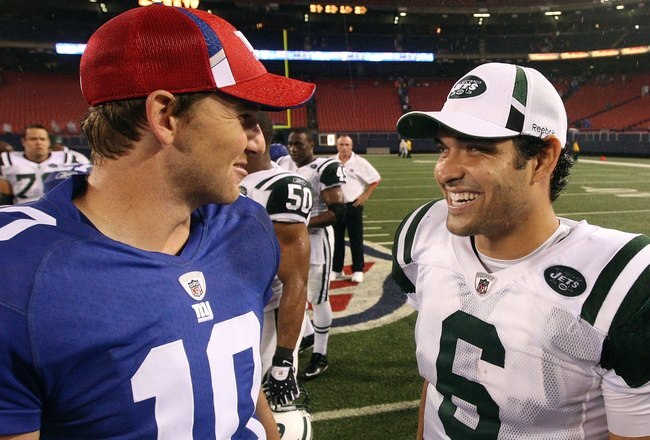 EAST RUTHERFORD, NJ - AUGUST 29:  Eli Manning #10 of the New York Giants talks with Mark Sanchez #6 of the New York Jets after their game on August 29, 2009 at Giants Stadium in East Rutherford, New Jersey.  (Photo by Jim McIsaac/Getty Images)