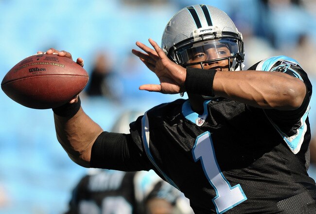 CHARLOTTE, NC - DECEMBER 11:  Quarterback Cam Newton #1 of the Carolina Panthers warms up prior to the game against the Atlanta Falcons at Bank of America Stadium on December 11, 2011 in Charlotte, North Carolina.  (Photo by Jared C. Tilton/Getty Images)