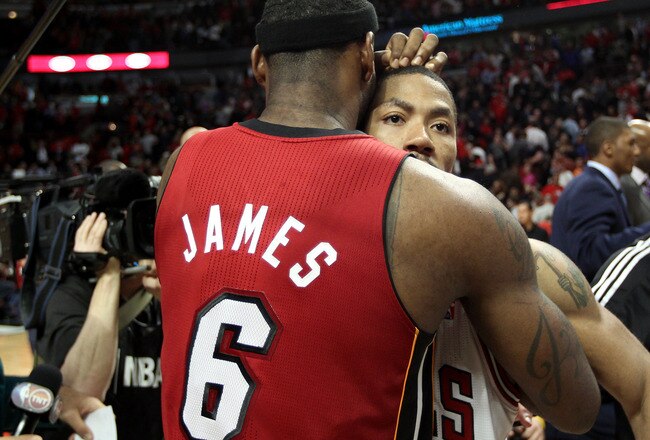 CHICAGO, IL - MAY 26:  Derrick Rose #1 of the Chicago Bulls looks on dejected as he congratulates LeBron James #6 of the Miami Heat after the Heat won 83-80 in Game Five of the Eastern Conference Finals during the 2011 NBA Playoffs on May 26, 2011 at the United Center in Chicago, Illinois. NOTE TO USER: User expressly acknowledges and agrees that, by downloading and or using this photograph, User is consenting to the terms and conditions of the Getty Images License Agreement.  (Photo by Mike Ehrmann/Getty Images)