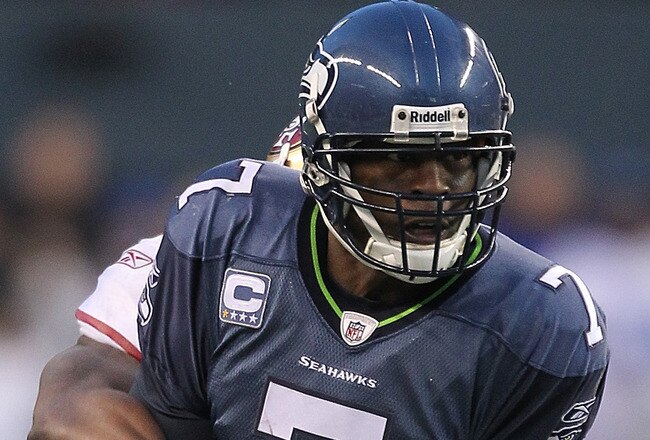 SEATTLE - DECEMBER 24:  Quarterback Tarvaris Jackson #7 of the Seattle Seahawks fumbles late in the game while being tackled by Larry Grant #54 of the San Francisco 49ers at CenturyLink Field on December 24, 2011 in Seattle, Washington. The 49ers defeated the Seahawks 19-17. (Photo by Otto Greule Jr/Getty Images)