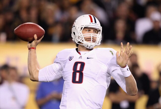 TEMPE, AZ - NOVEMBER 19:  Quarterback Nick Foles #8 of the Arizona Wildcats throws a pass during the college football game against the Arizona State Sun Devils at Sun Devil Stadium on November 19, 2011 in Tempe, Arizona. The Wildcats defeated the Sun Devils 31-27.  (Photo by Christian Petersen/Getty Images)