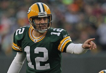 GREEN BAY, WI - DECEMBER 11:  Aaron Rodgers  #12 of the Green Bay Packers calls out a defensive alignment against the Oakland Raiders at Lambeau Field on December 11, 2011 in Green Bay, Wisconsin. The Packers defeated the Raiders 46-16.  (Photo by Jonathan Daniel/Getty Images)