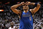 MIAMI, FL - JUNE 12:  Shawn Marion #0 of the Dallas Mavericks reacts as Dwyane Wade #3 of the Miami Heat looks on in the background in Game Six of the 2011 NBA Finals at American Airlines Arena on June 12, 2011 in Miami, Florida. THe Mavericks won 105-95. NOTE TO USER: User expressly acknowledges and agrees that, by downloading and/or using this Photograph, user is consenting to the terms and conditions of the Getty Images License Agreement.  (Photo by Mike Ehrmann/Getty Images)