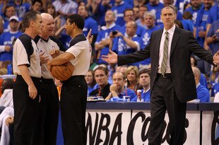 DALLAS, TX - JUNE 09: (L-R) Referees Mike Callahan #24, Joe Crawford #17 and Bill Kennedy #55 talk in a huddle as head coach Rick Carlisle of the Dallas Mavericks reacts against the Miami Heat in Game Five of the 2011 NBA Finals at American Airlines Center on June 9, 2011 in Dallas, Texas.  NOTE TO USER: User expressly acknowledges and agrees that, by downloading and/or using this Photograph, user is consenting to the terms and conditions of the Getty Images License Agreement.  (Photo by Mike Ehrmann/Getty Images)