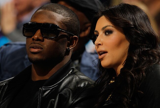 NEW ORLEANS - JANUARY 18:  New Orleans Saints player Reggie Bush sits with Kim Kardashian on the court during the game between the San Antonio Spurs and the New Orleans Hornets at New Orleans Arena on January 18, 2010 in New Orleans, Louisiana.   NOTE TO USER: User expressly acknowledges and agrees that, by downloading and/or using this Photograph, User is consenting to the terms and conditions of the Getty Images License Agreement.  (Photo by Chris Graythen/Getty Images)