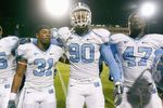 DURHAM, NC - NOVEMBER 29:  Carter Brown #35, Trimane Goddard #31, Quinton Coples #90 and Zach Brown #47 of the North Carolina Tar Heels celebrate after game against the Duke Blue Devils at Wallace Wade Stadium on November 29, 2008 in Durham, North Carolina. (Photo by Kevin C. Cox/Getty Images)