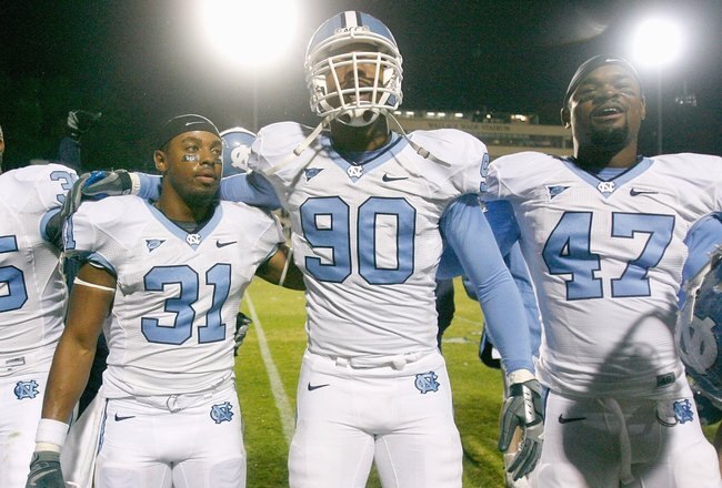 DURHAM, NC - NOVEMBER 29:  Carter Brown #35, Trimane Goddard #31, Quinton Coples #90 and Zach Brown #47 of the North Carolina Tar Heels celebrate after game against the Duke Blue Devils at Wallace Wade Stadium on November 29, 2008 in Durham, North Carolina. (Photo by Kevin C. Cox/Getty Images)