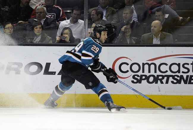 SAN JOSE, CA - DECEMBER 08:  Ryane Clowe #29 of the San Jose Sharks looks to get control of the puck against the Dallas Stars at HP Pavilion at San Jose on December 8, 2011 in San Jose, California. The Sharks won the game 5-2. (Photo by Thearon W. Henderson/Getty Images)