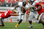 COLUMBUS, OH - SEPTEMBER 10:  Terrance Owens is tackled by John Simon #54 of the Ohio State Buckeyes and Johnathan Hankins #52 of the Ohio State Buckeyes during the fourth quarter on September 10, 2011 at Ohio Stadium in Columbus, Ohio. Ohio State defeated Toledo 27-22. (Photo by Kirk Irwin/Getty Images)