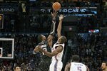 OKLAHOMA CITY, OK - DECEMBER 25:  Dwight Howard #12 of the Orlando Magic and Serge Ibaka #9 of the Oklahoma City Thunder jump for the ball at tip off during the NBA season opening game December 25, 2011 at the Chesapeake Energy Arena in Oklahoma City, Oklahoma.  Oklahoma City defeated Orlando 97-89. NOTE TO USER: User expressly acknowledges and agrees that, by downloading and or using this Photograph, user is consenting to the terms and conditions of the Getty Images License Agreement.  (Photo by Brett Deering/Getty Images)