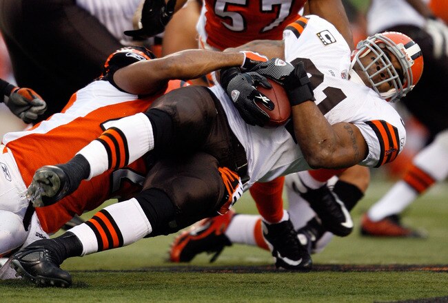 CINCINNATI - NOVEMBER 29:  Jamal Lewis #31 of the Cleveland Browns is tackled by Chris Crocker #42 of the Cincinnati Bengals during the NFL game at Paul Brown Stadium on November 29, 2009 in Cincinnati, Ohio.  (Photo by Andy Lyons/Getty Images)