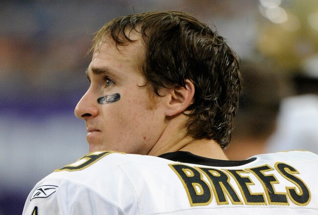 MINNEAPOLIS, MN - DECEMBER 18: Drew Brees #9 of the New Orleans Saints looks on from the bench in the fourth quarter against the Minnesota Vikings on December 18, 2011 at Mall of America Field at the Hubert H. Humphrey Metrodome in Minneapolis, Minnesota. The Saints defeated the Vikings 42-20. (Photo by Hannah Foslien/Getty Images)