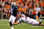 AUBURN, AL - NOVEMBER 26:  Michael Dyer #5 of the Auburn Tigers is tackled by Vinnie Sunseri #3 of the Alabama Crimson Tide at Jordan-Hare Stadium on November 26, 2011 in Auburn, Alabama.  (Photo by Kevin C. Cox/Getty Images)